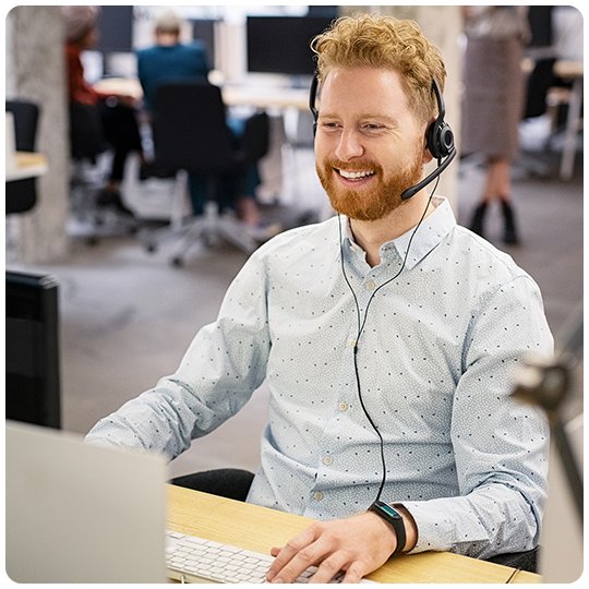 Secretary with a headset handling the practice's calls
